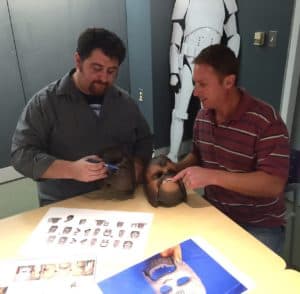 Bill Rawley [left] and Chewbacca mask engineer Todd Giroux are reviewing sculpt and paint images to ensure all of the teams comments have been addressed in the latest iteration of the product. The mask on the left is an early version without the finished paint. 