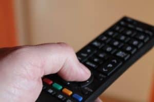 hand holding smart tv remote